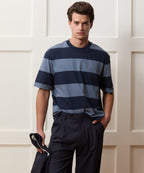 Model wearing the Todd Snyder Rugby Striped Cropped Jersey Tee in Blue.