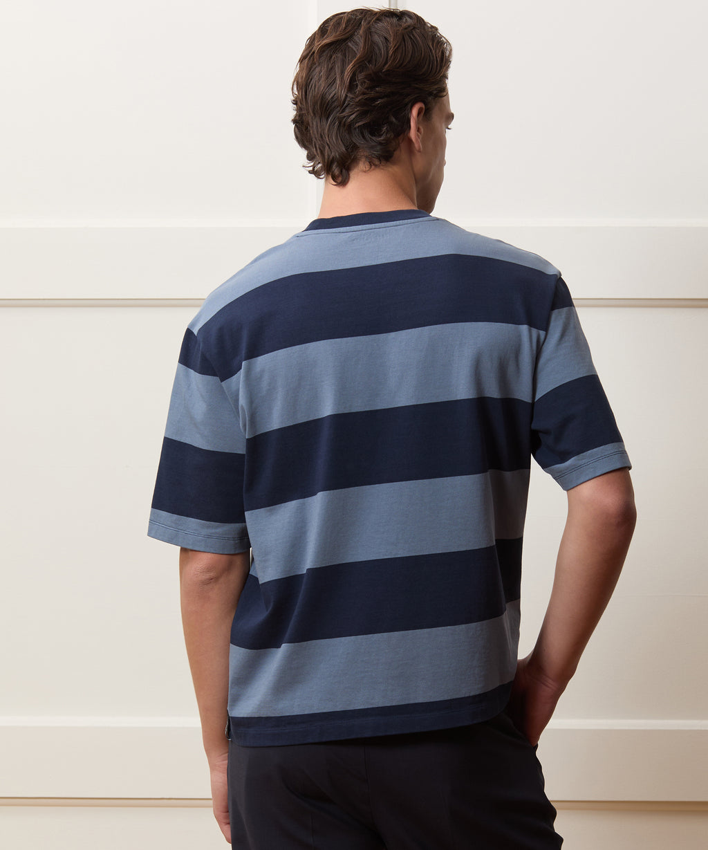 Model wearing the Todd Snyder Rugby Striped Cropped Jersey Tee in Blue.