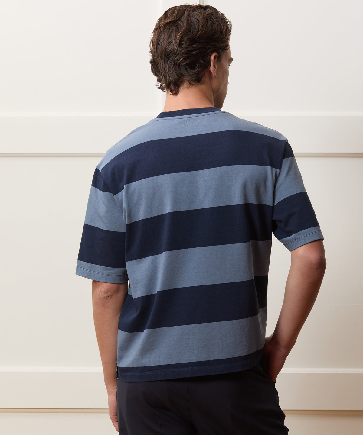 Model wearing the Todd Snyder Rugby Striped Cropped Jersey Tee in Blue.