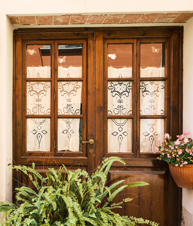 The doors of an artisan shop are shown, showing the small scale of these producers.